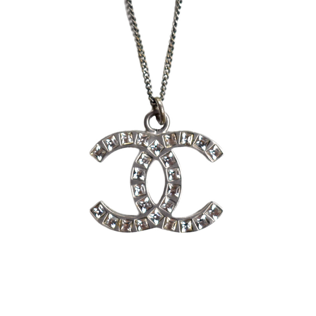 Silver Chanel CC necklace with rhinestone diamante pendant, close-up front view