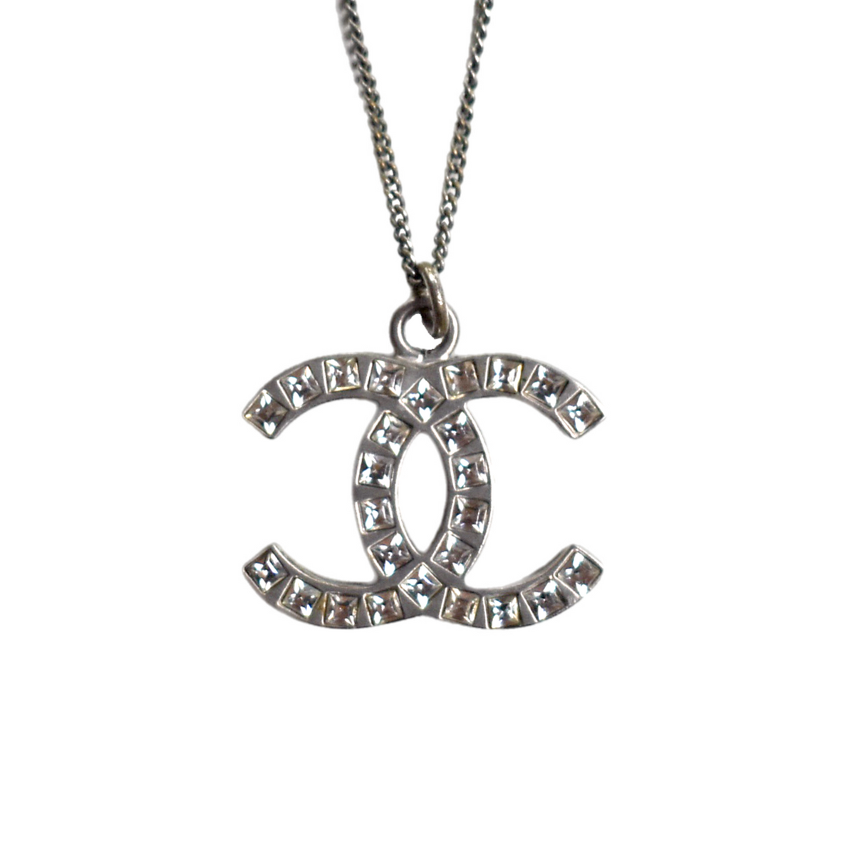 Silver Chanel CC necklace with rhinestone diamante pendant, close-up front view