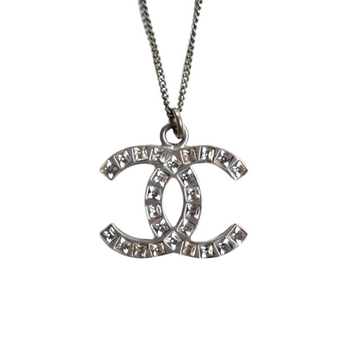 Silver Chanel CC necklace with rhinestone diamante pendant, close-up front view