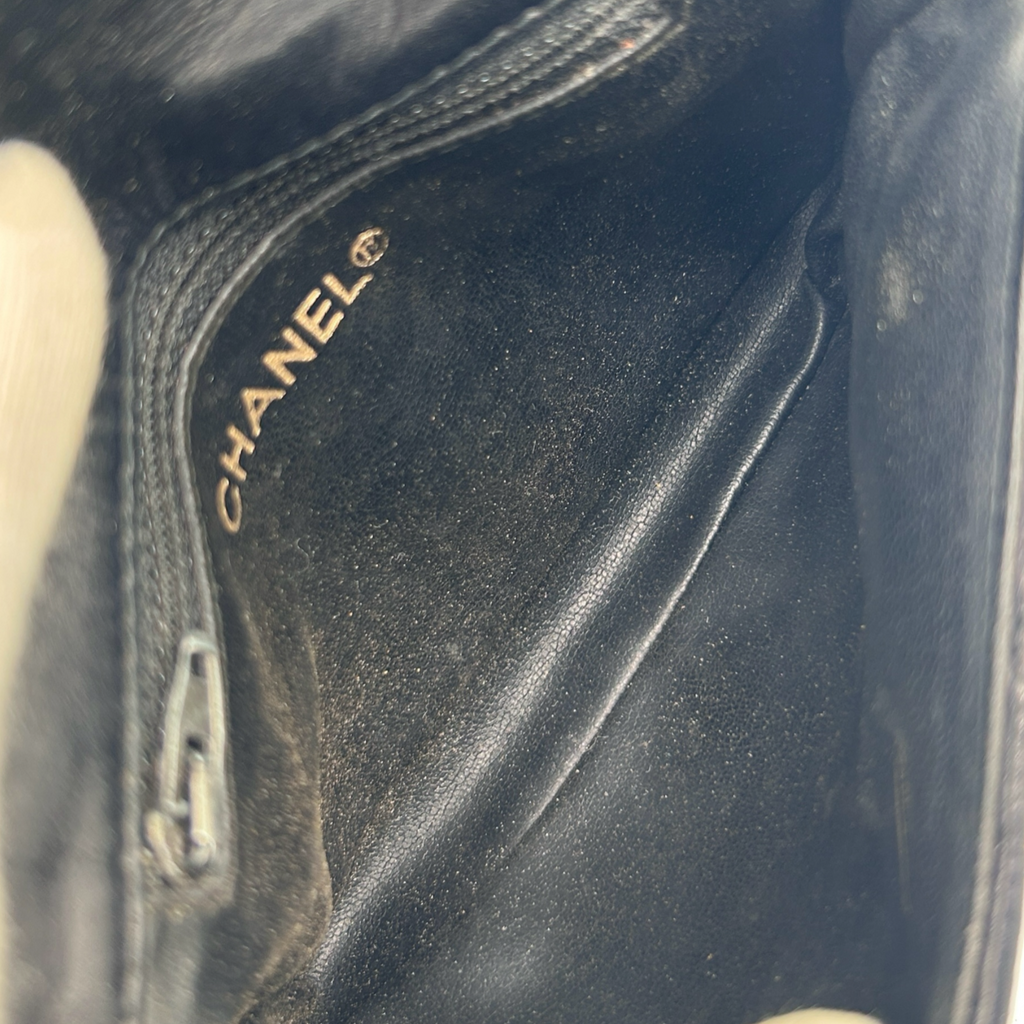 Interior pocket of vintage black Chanel Turnlock belt bag