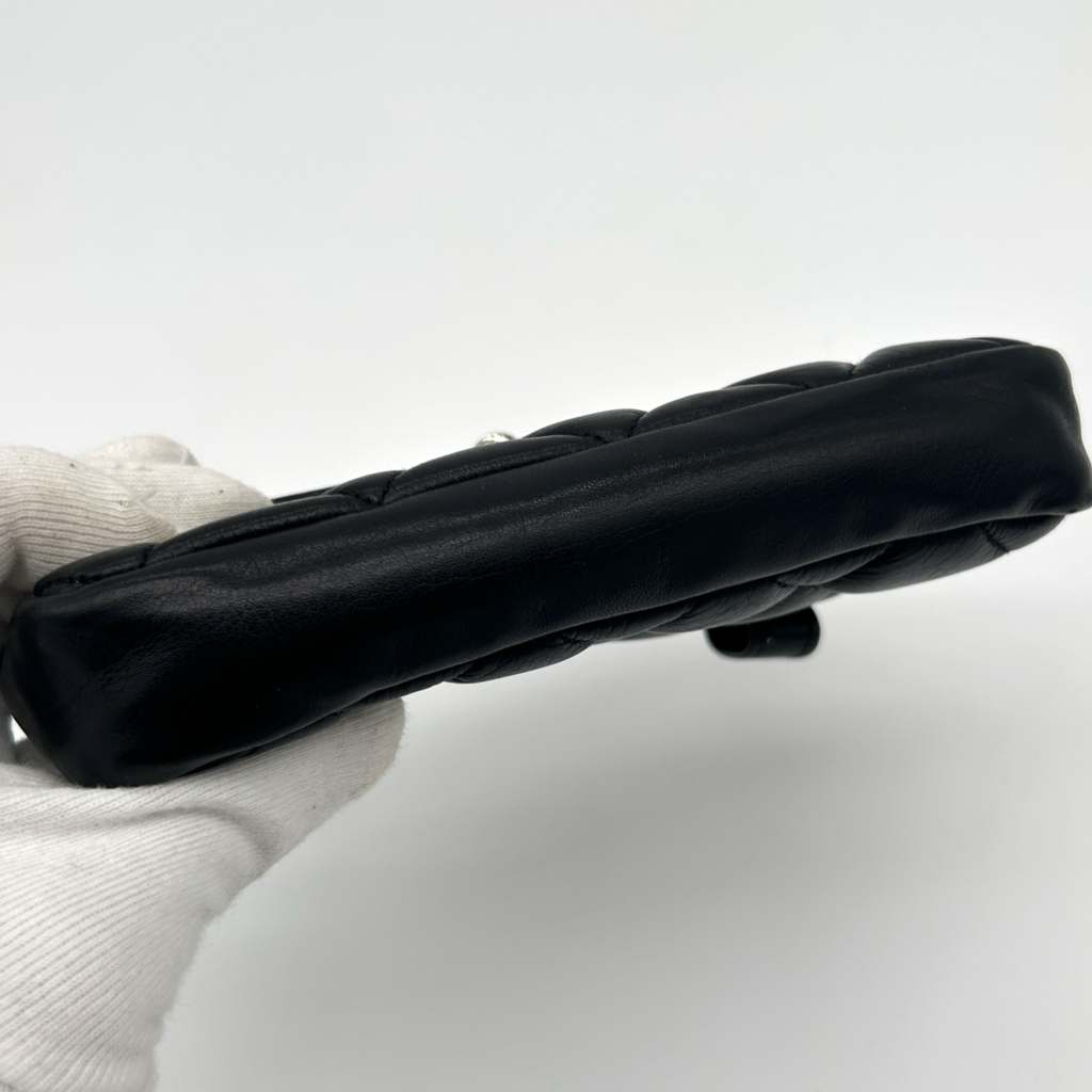 Base of vintage black Chanel Turnlock matelassé belt bag