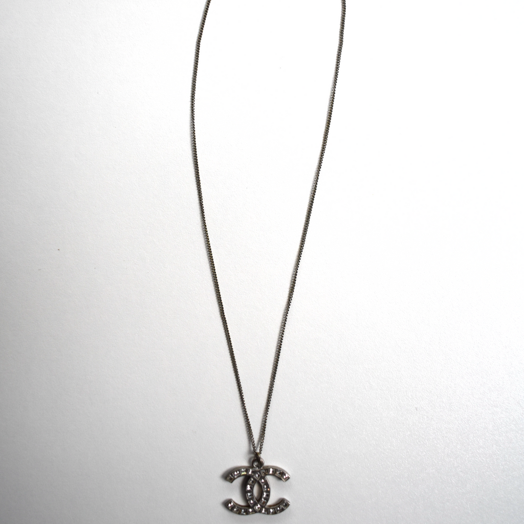 Full silver Chanel CC rhinestone necklace laid flat