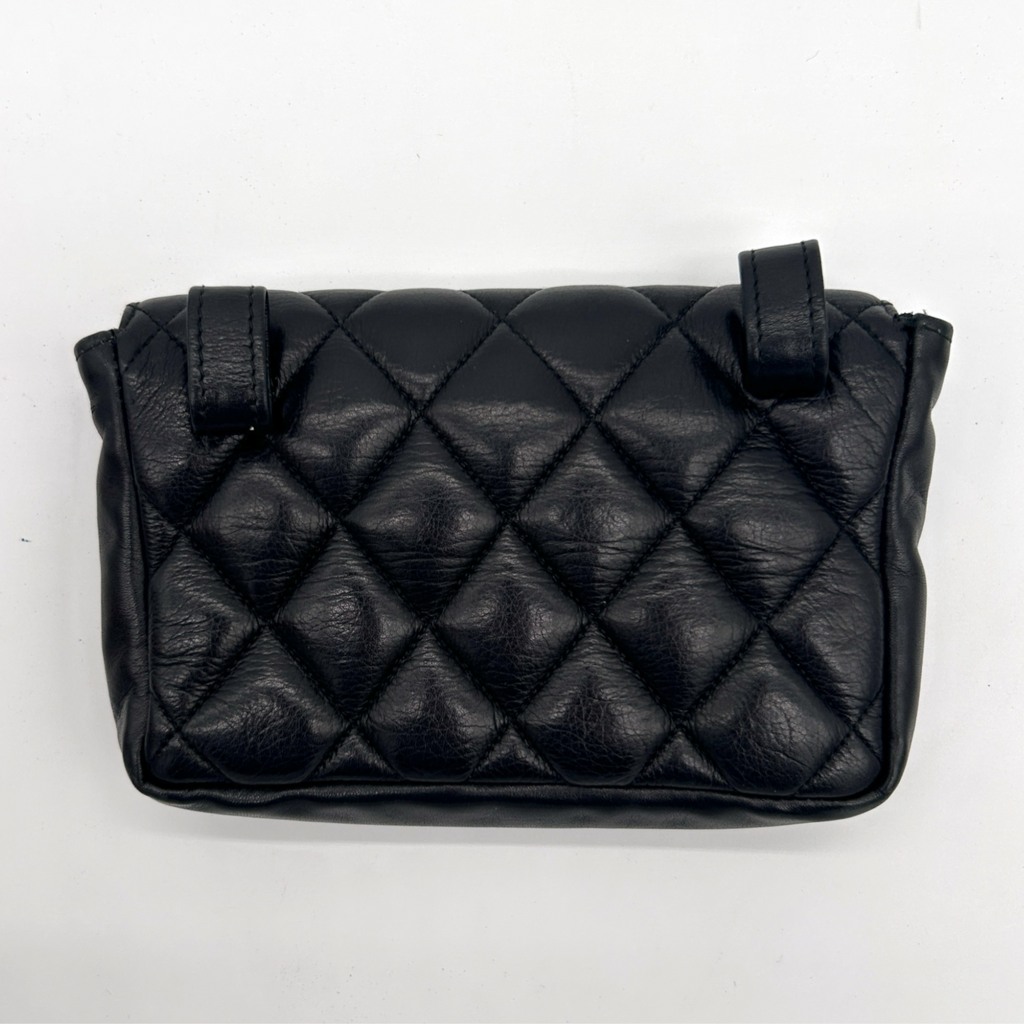 Back of vintage black Chanel Turnlock matelassé belt bag