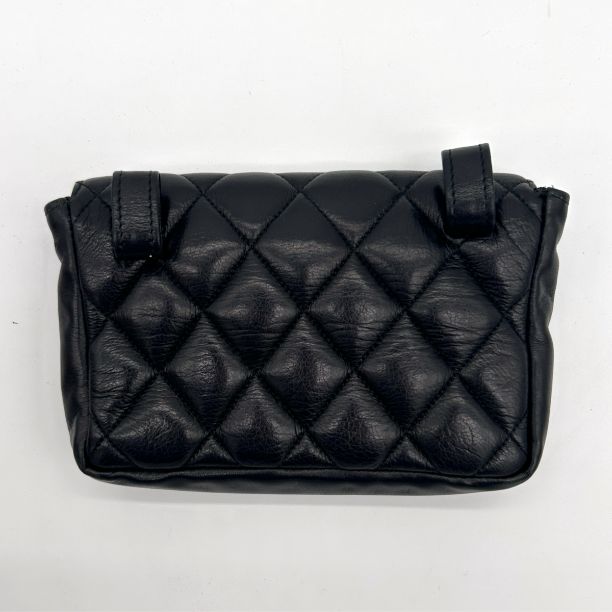 Back of vintage black Chanel Turnlock matelassé belt bag