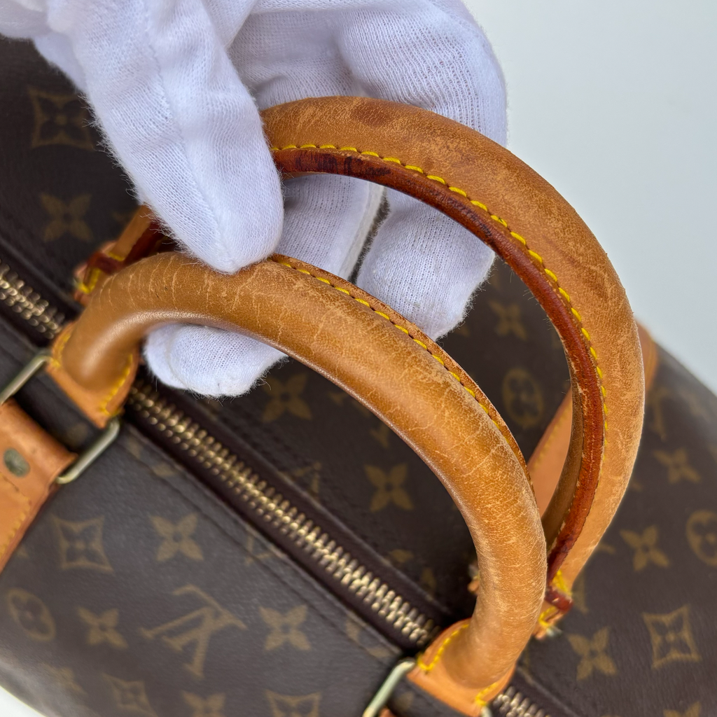 Leather handles of vintage Louis Vuitton Bandoulière 55 holdall