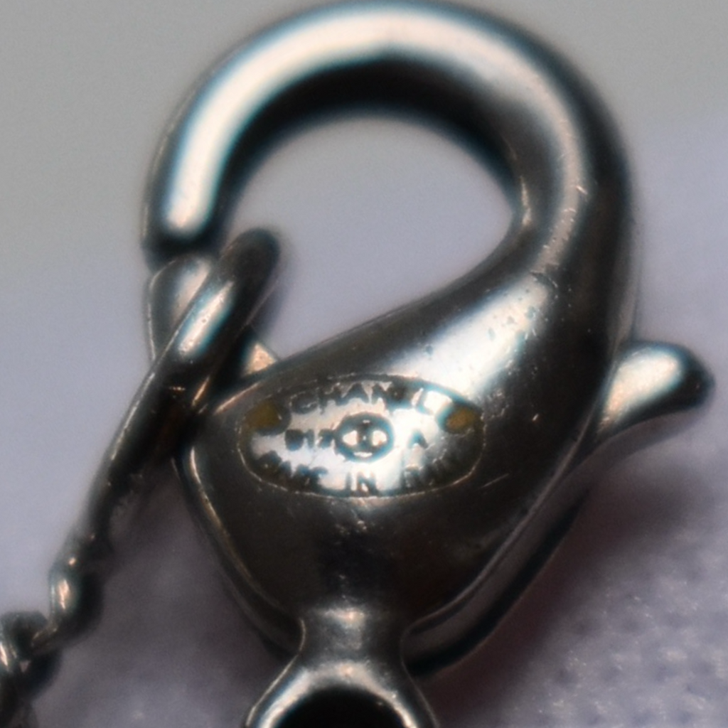 Second view of Chanel B12A code stamp on silver CC necklace