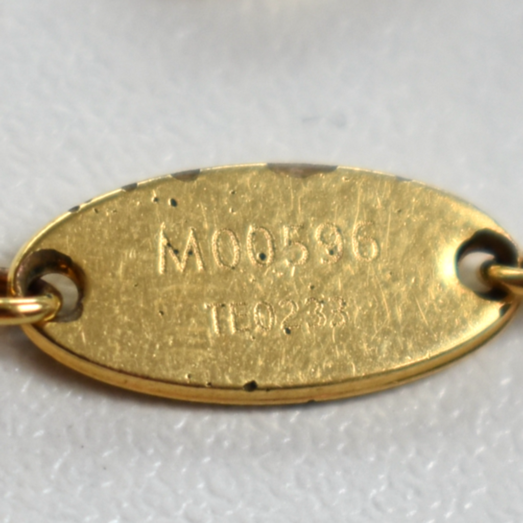 Date code TH0233 engraving on gold Louis Vuitton rhinestone necklace